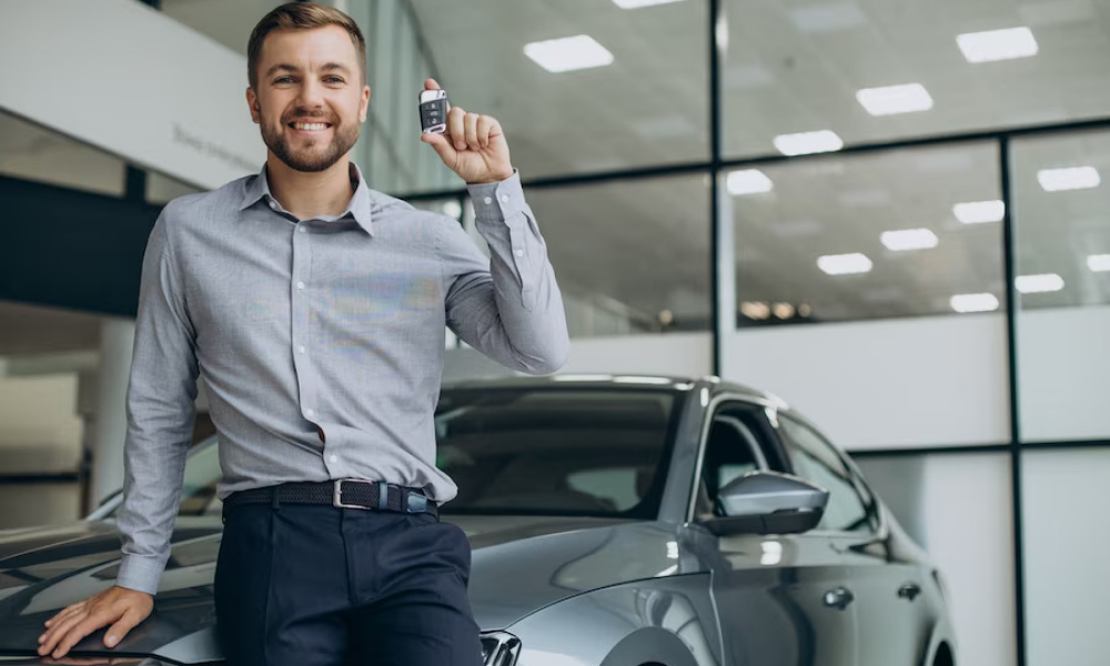 An engineer showing a customer car under hood