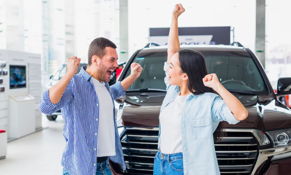 An engineer showing a customer car under hood