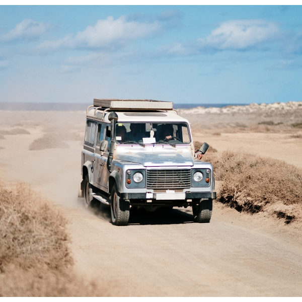 A family smiling in a car