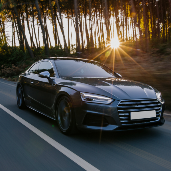 A family smiling in a car